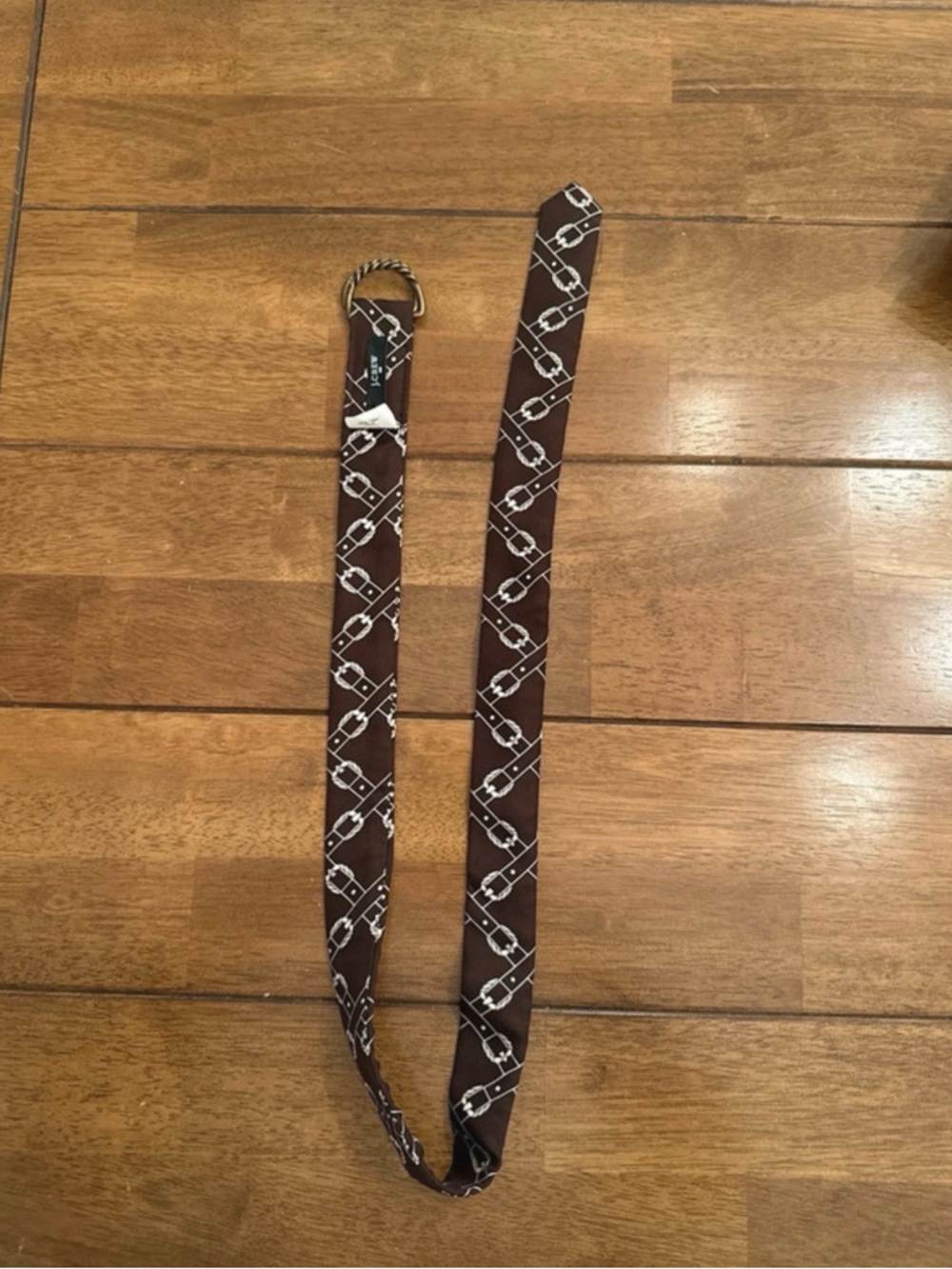 Brown J Crew buckle horse belt. 100 percent silk. 40 inches